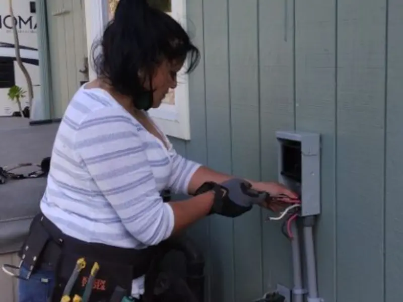 Licensed electrician wiring an exterior subpanel in Discovery Bay