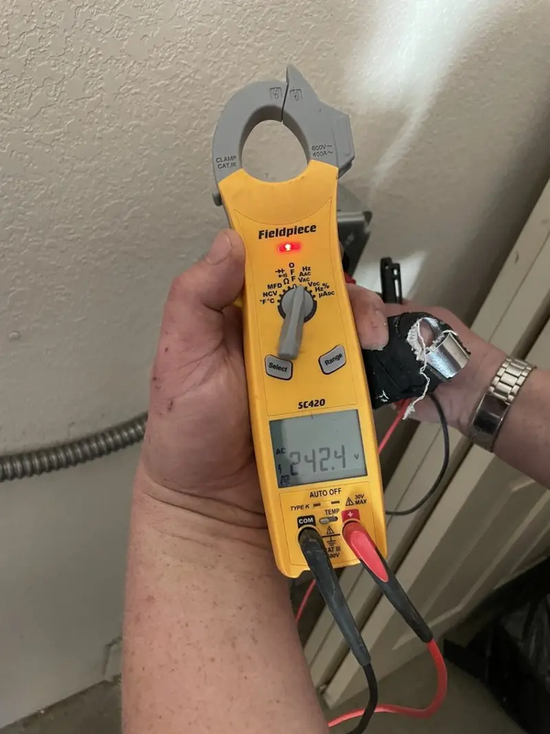 Voltage testing with clamp meter during Outlet Installation in Discovery Bay